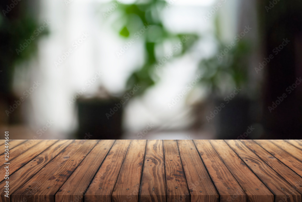 old wooden advertising table on blurred background, burnt wood texture, home room with window and flowers, old wooden advertising table on blurred background, burnt wood texture, home room with window and flowers,