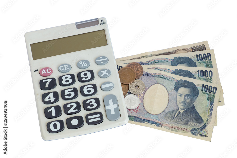 Mixed coin on calculator and money on Japan banknote with isolated white background Mixed coin on calculator and money on Japan banknote with isolated white background