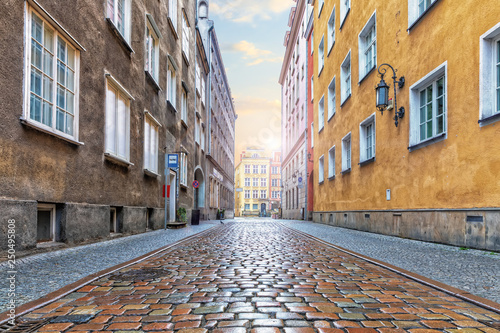 Empty european street with pebble stone pavement in the downtown of Gdansk, Poland