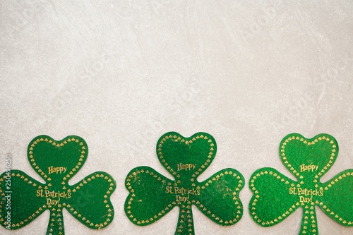 St Patrick's day background with shamrock and clover leaves