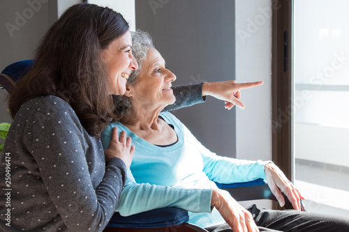 Quadro em tela Joyful woman taking care of elderly mother