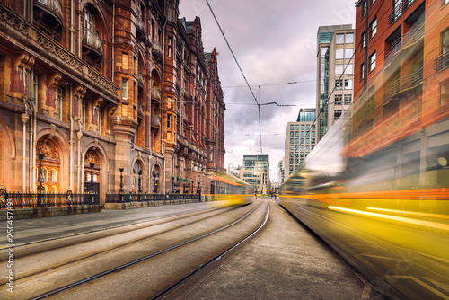 Pair of tram light trails at St Peter's Square, Manchester, England.