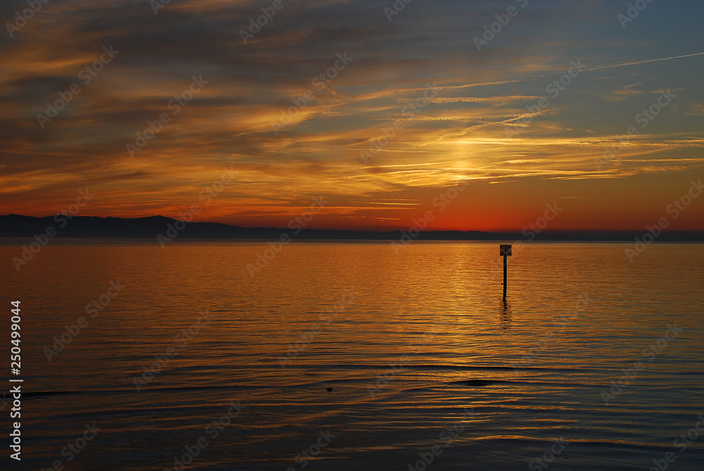 Lindau, Germany: A view of the Bodensee (aka Lake Constance), in the distance Austria, and Switzerland, at sunset in the summer