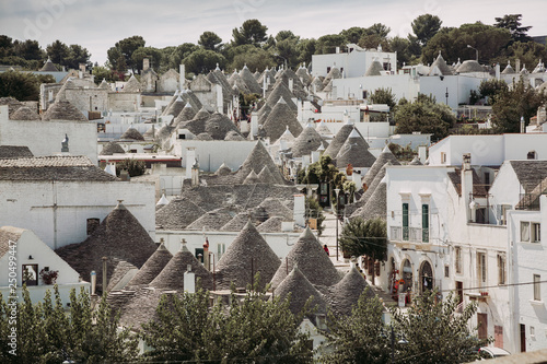 Traditional trulli houses in Arbelobello, Puglia, Italy photo