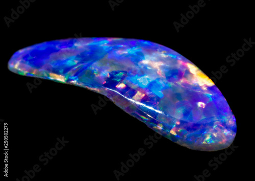 Natural piece of blue opal on a black background