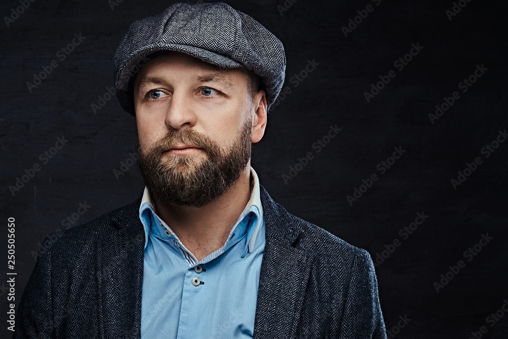 Close-up portrait of a stylish old-fashioned man wearing a beret and jacket Close-up portrait of a stylish old-fashioned man wearing a beret and jacket
