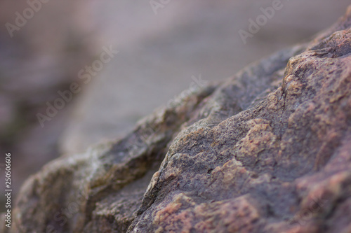 Granite rocks with blurred background. Granite close up. Texture of the stone. Natural material background