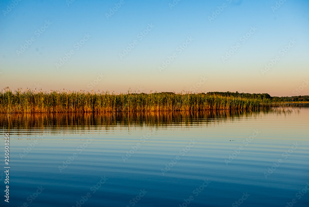 calm weather sunset on country lake calm weather sunset on country lake