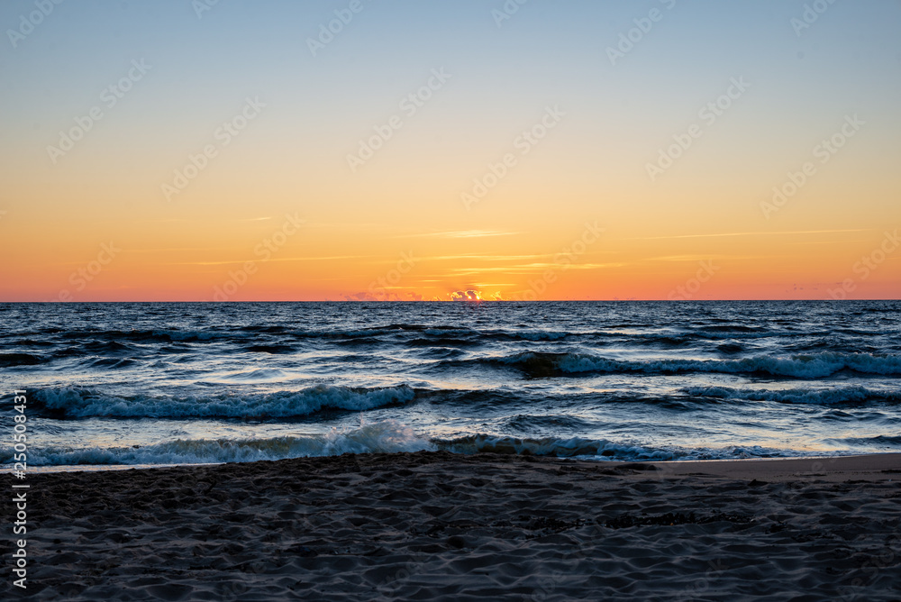 colorful sunset on the sea beach in summer