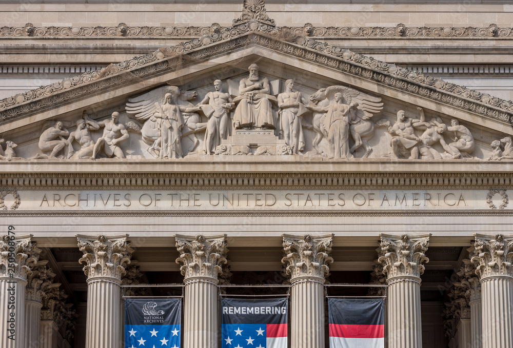 United States National Archive Building in Washington DC with USA flag United States National Archive Building in Washington DC with USA flag