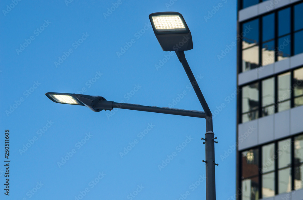 A modern street LED lighting pole. Urban electro-energy technologies. Savings on street urban road lighting. A modern street LED lighting pole. Urban electro-energy technologies. Savings on street urban road lighting.