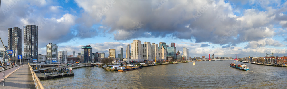 Cityscape, panorama, banner - view from the Erasmus Bridge to the River Maas and the City of Rotterdam, The Netherlands, December 28, 2017