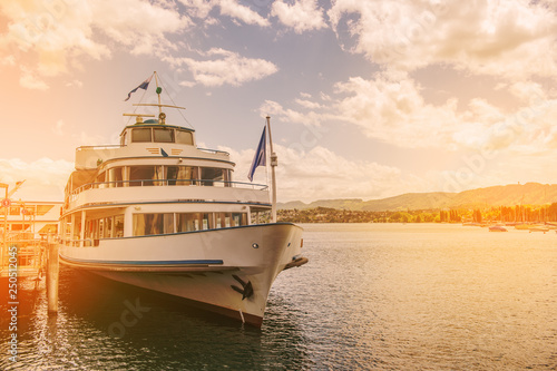 Fotografie Steam boat on lake Zurich in sunset light, Switzerland
