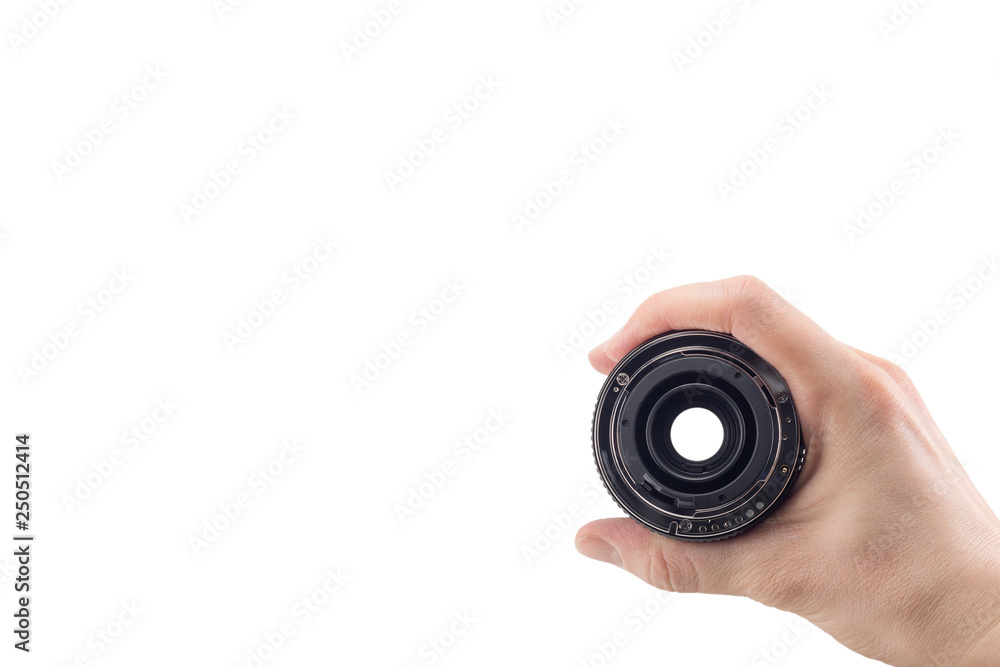 view of the back lens of the detachable camera lens in hand, the back of the lens, mount to the camera, isolated on white background view of the back lens of the detachable camera lens in hand, the back of the lens, mount to the camera, isolated on white background