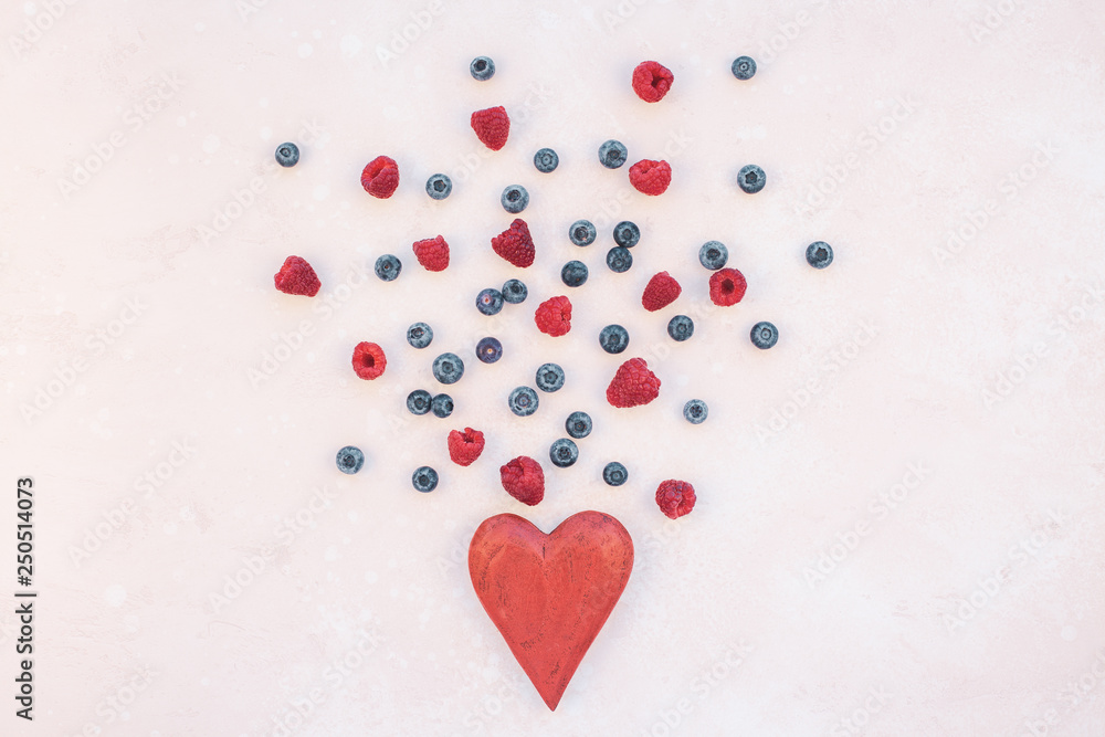 Valentine Day composition berries and red heart