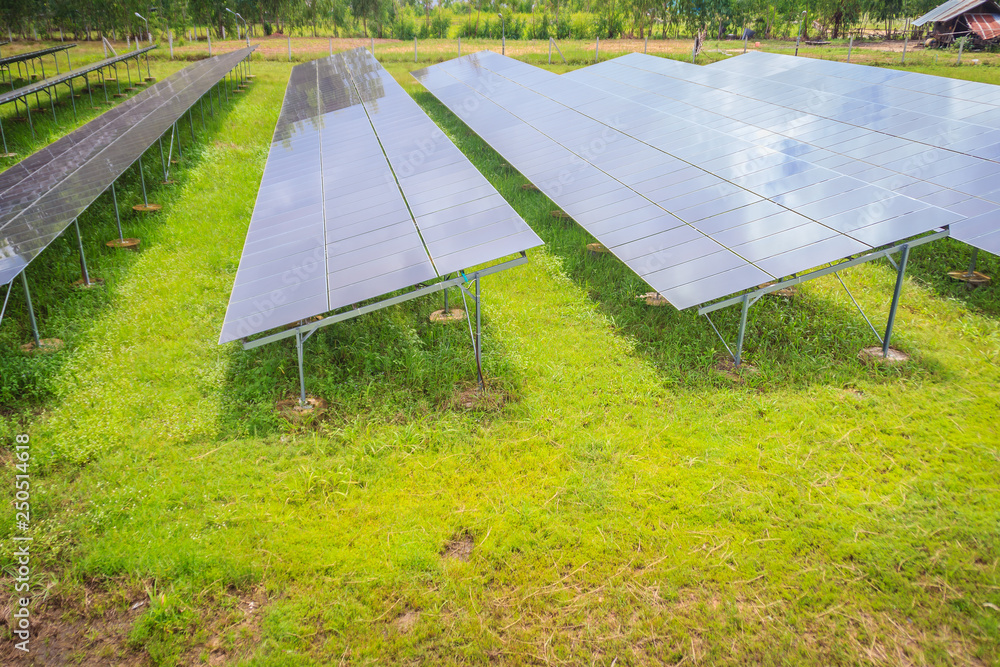 Solar cells (photovoltaic panel) with the reflection of sunlight, blue sky  and white clouds. Solar energy