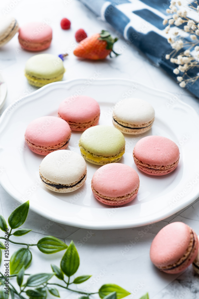 Obraz premium Macaron or French macaroon cookies dessert. Set on cafe table.