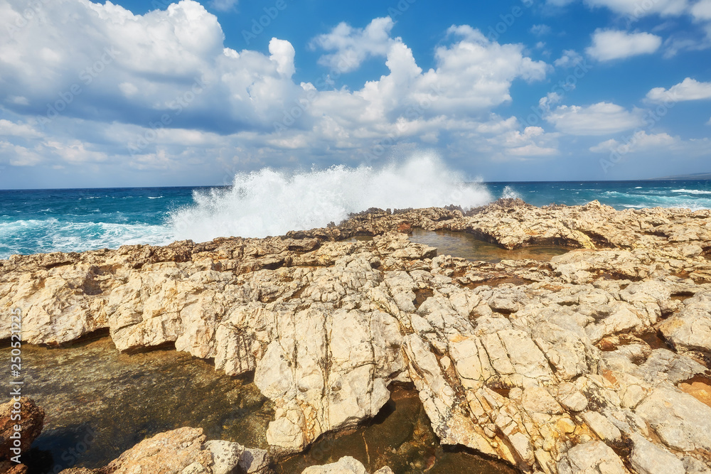 Waves beat on the rocky shore, Mediterranean Sea.