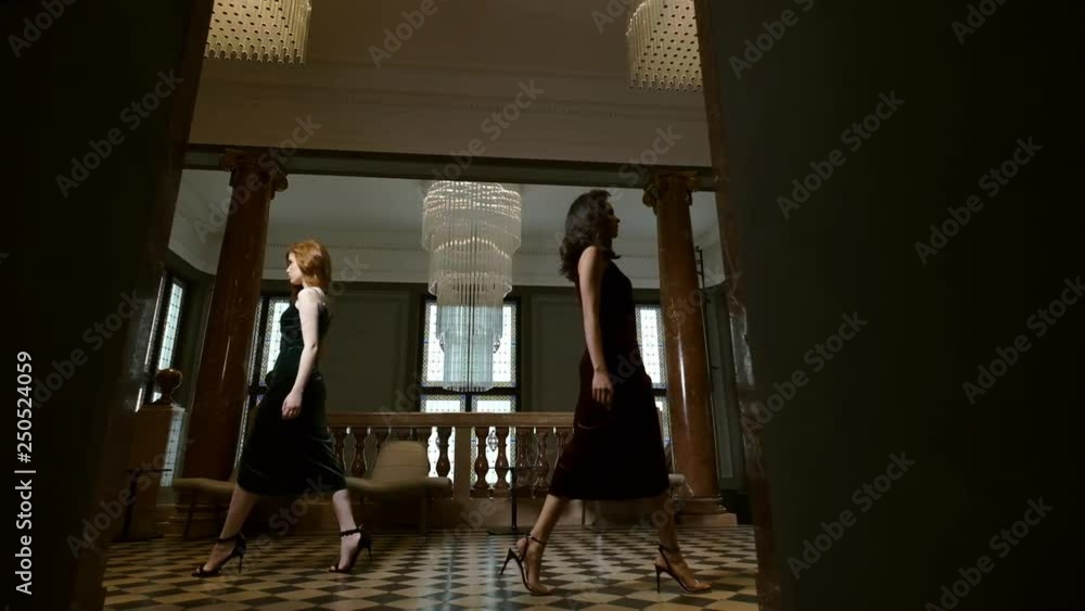 Glamorous Fashion Models Pose In A Luxurious Building. Glamorous Fashion Models Pose In A Luxurious Building.