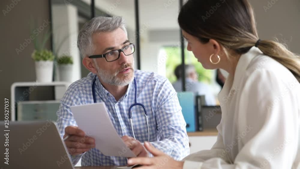 Patient having medical appointment with practitioner in doctor's office Patient having medical appointment with practitioner in doctor's office