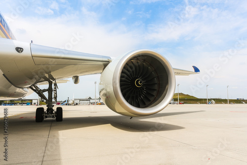 Engine of modern passenger jet airplane. Rotating fan and turbine blades.