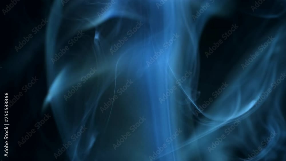 Smoke rising graceful twists on black background blowing from bottom to top. Closeup, ProRes, 50 fps Smoke rising graceful twists on black background blowing from bottom to top. Closeup, ProRes, 50 fps