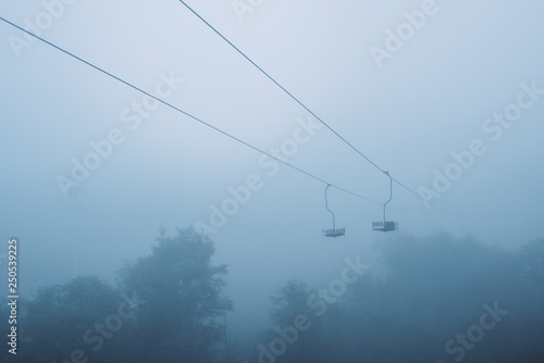 Old chairlift in the fog