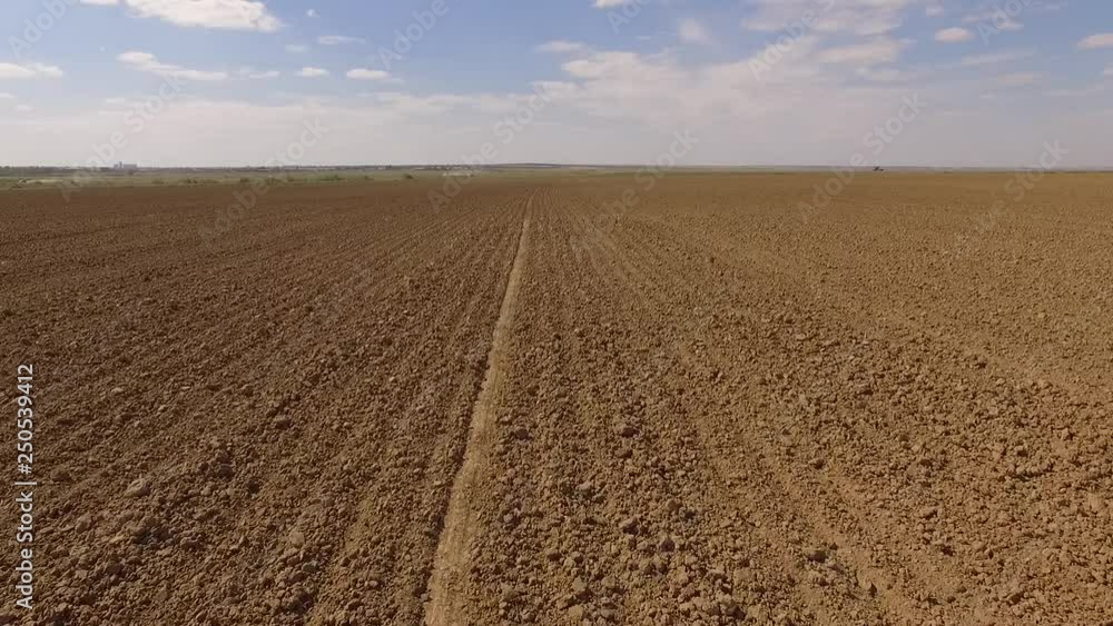 fly over the brown ploughed field fly over the brown ploughed field