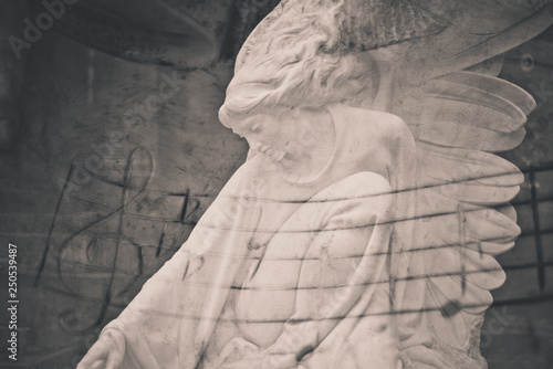 Statue of women with wings and notes (double exposition)