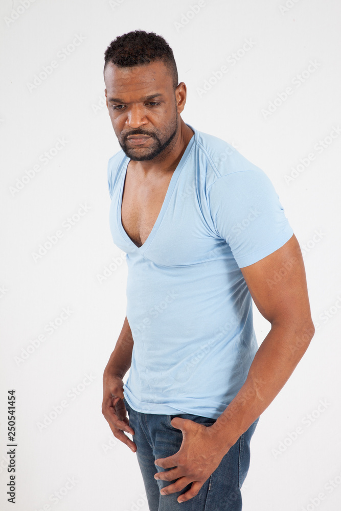 Serious Black man in blue shirt Serious Black man in blue shirt