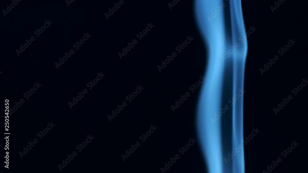 Trickle of smoke slowly rising, graceful twists on black background blowing from bottom to top. Closeup, ProRes, 50 fps Trickle of smoke slowly rising, graceful twists on black background blowing from bottom to top. Closeup, ProRes, 50 fps