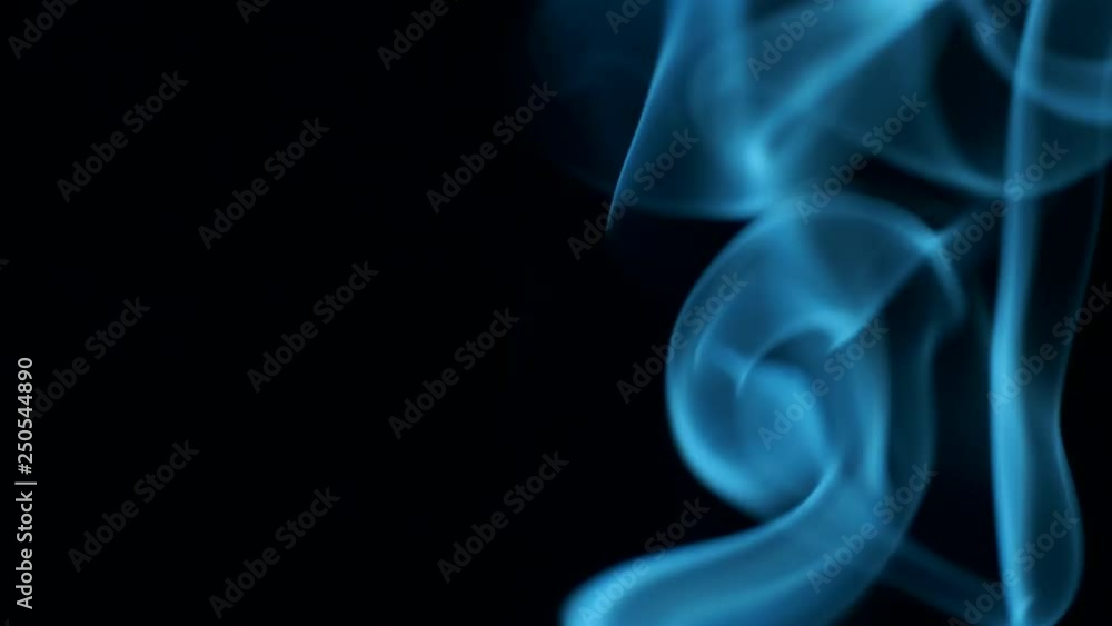 Trickle of smoke slowly rising, graceful twists on black background blowing from bottom to top. Closeup, ProRes, 50 fps Trickle of smoke slowly rising, graceful twists on black background blowing from bottom to top. Closeup, ProRes, 50 fps
