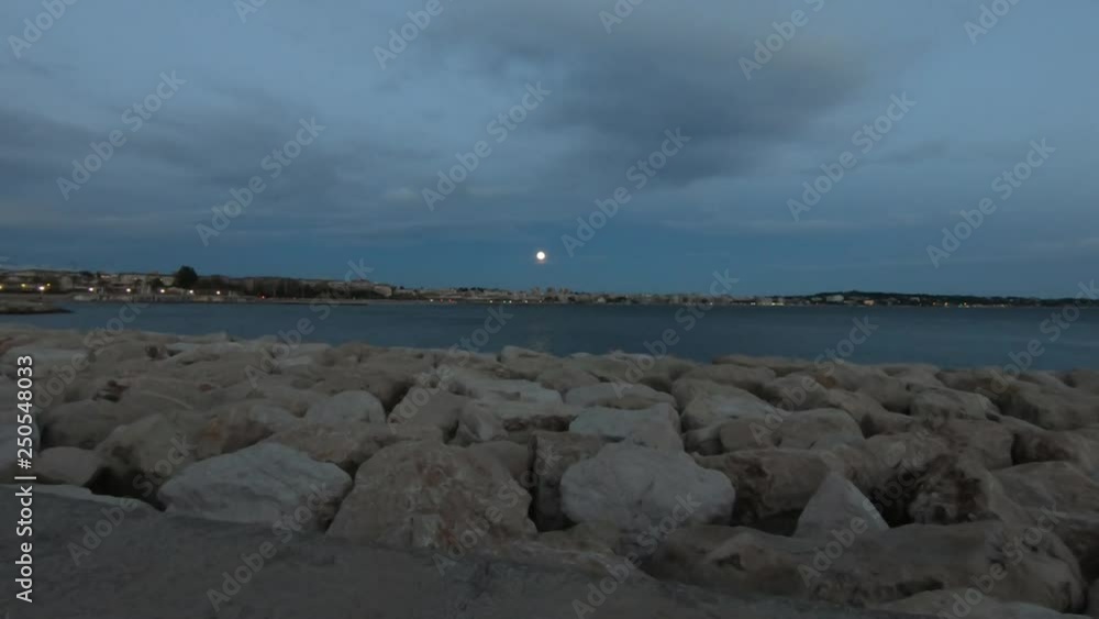 super moon above the Mediterranean shore line near Antibes on the French Riviera super moon above the Mediterranean shore line near Antibes on the French Riviera