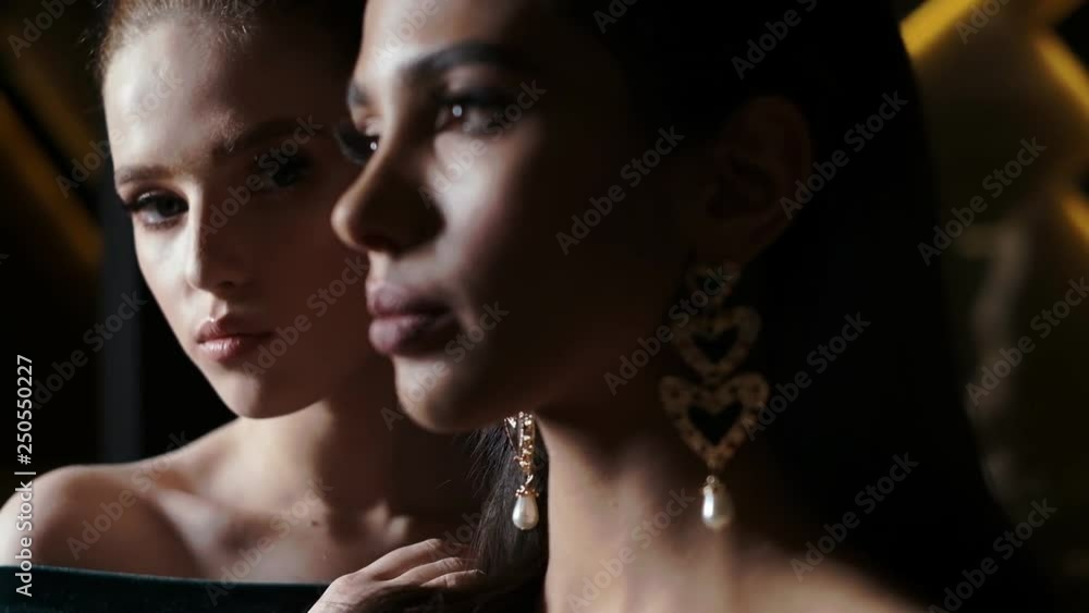 Glamorous Girls Posing In Hotel Lobby. Close up. Glamorous Girls Posing In Hotel Lobby. Close up.