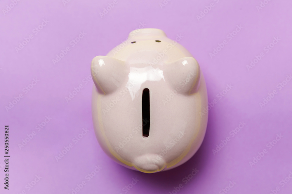 Saving investment budget wealth retirement financial money banking concept. Pink piggy bank isolated on purple violet pastel colourful trendy background. Flat lay top view copy space Saving investment budget wealth retirement financial money banking concept. Pink piggy bank isolated on purple violet pastel colourful trendy background. Flat lay top view copy space