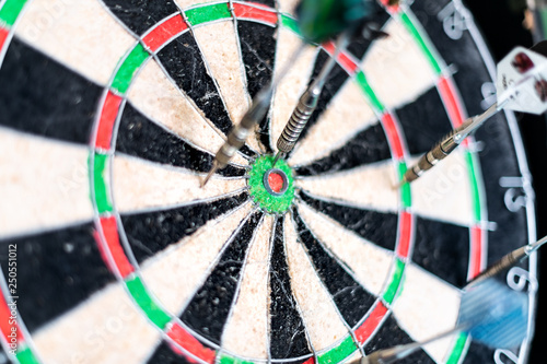 Closeup of dart bulls eye with arrows and colorful pattern red green color isolated sports game and nobody