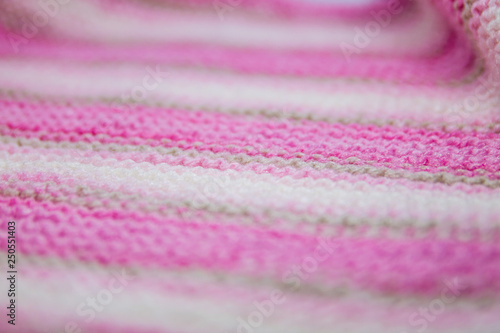 Pink, white and light brown striped knitted texture background