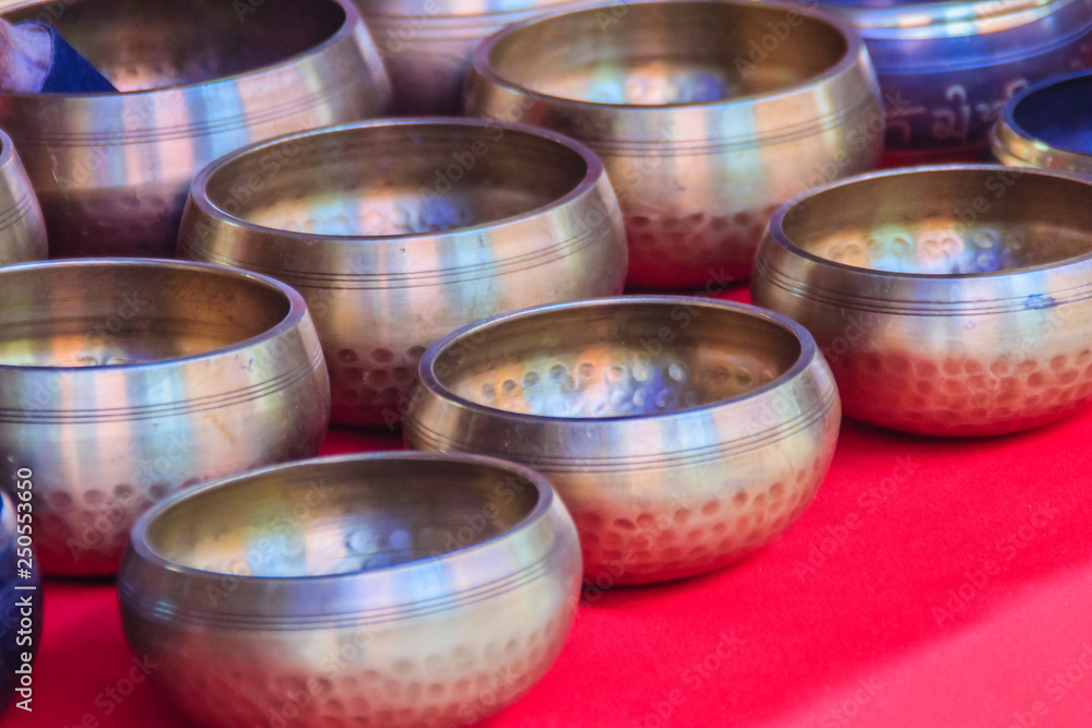 Tibetan singing bowls for sale at the antique market. Singing bowls