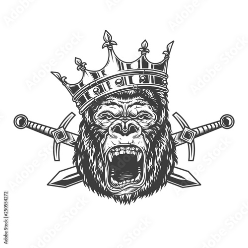 Angry gorilla head in royal crown photo