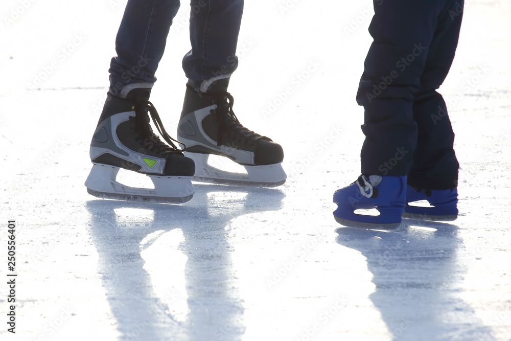 Feet skating on the ice rink Feet skating on the ice rink