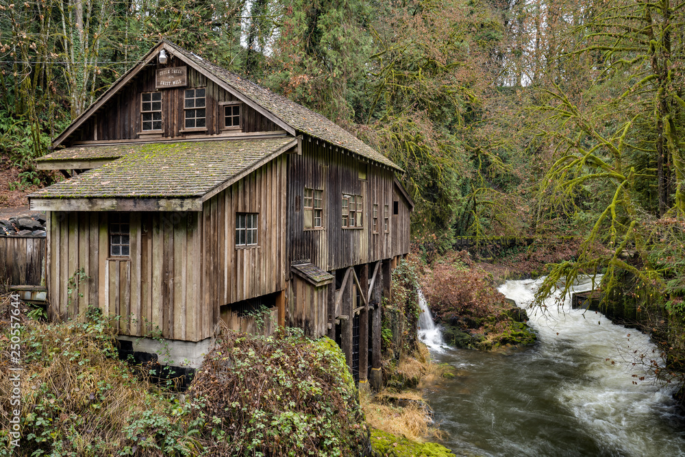 Historic mill alongside a creek in the Pacific Northwest Historic mill alongside a creek in the Pacific Northwest