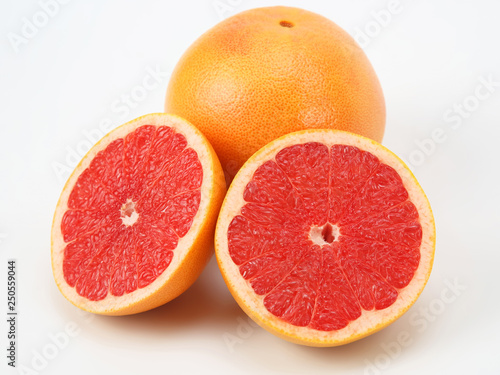 Cut citrus grapefruit fruit on white background