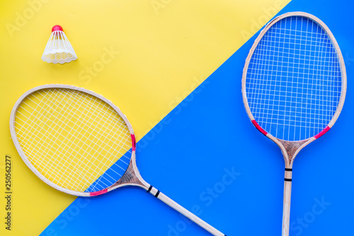 Badminton equipment. Badminton rackets and shuttlecock on yellow and blue  background top view copy space Stock Photo | Adobe Stock