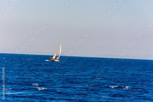 The small boat sailing in the Aegean sea