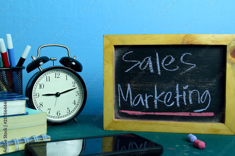 Sales Marketing Planning on Background of Working Table with Office Supplies. Business Concept Planning on Blue Background Sales Marketing Planning on Background of Working Table with Office Supplies. Business Concept Planning on Blue Background