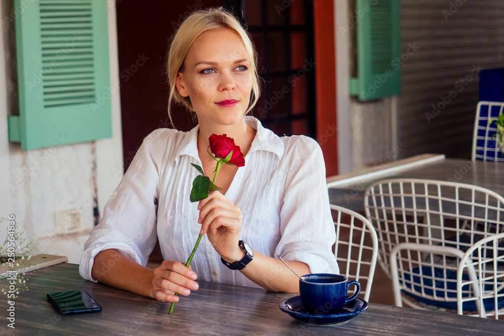 lady with rose in restaurant summer cafe - obrazy, fototapety, plakaty 