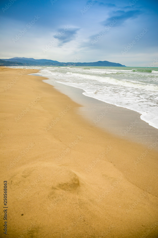 Empty sand beach in Paestum in cloudy day in winter, Cilento, Italy Empty sand beach in Paestum in cloudy day in winter, Cilento, Italy