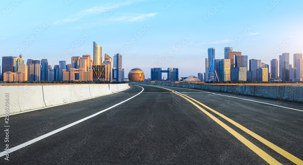 Empty asphalt road and modern city skyline with buildings in Hangzhou