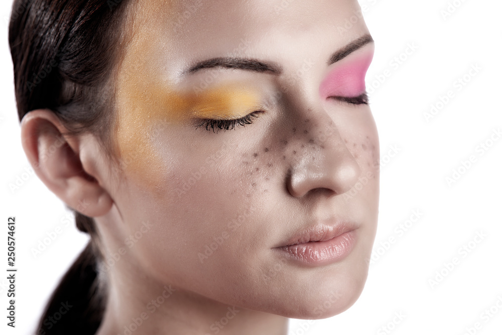 Young Caucasian Polish beauty model wears stunning cosmetics make-up that shows her stunning lips and bright colorful eye shadow in the studio Young Caucasian Polish beauty model wears stunning cosmetics make-up that shows her stunning lips and bright colorful eye shadow in the studio