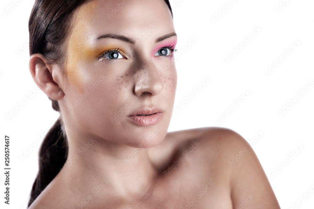 Young Caucasian Polish beauty model wears stunning cosmetics make-up that shows her stunning lips and bright colorful eye shadow in the studio Young Caucasian Polish beauty model wears stunning cosmetics make-up that shows her stunning lips and bright colorful eye shadow in the studio